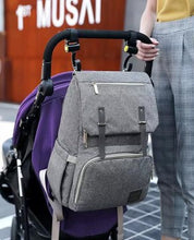 Kaylee Diaper Bag hung on a stroller by the stroller hooks