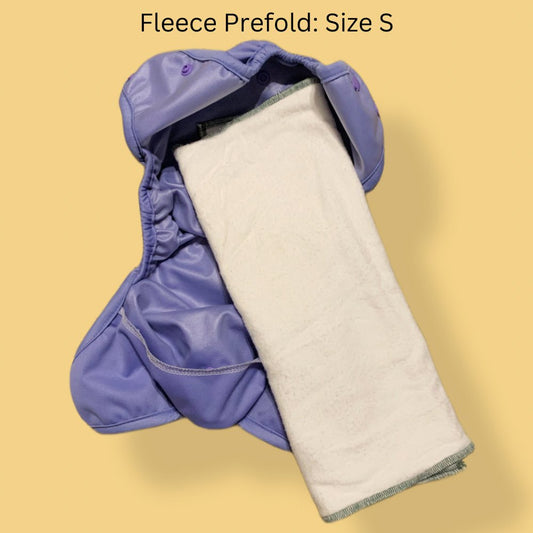 Geffen Baby Fleece Cloth Diaper Prefold folding in thirds laying inside a cloth diaper cover